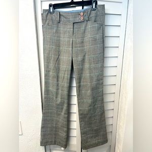 Gray plaid with light blue highlight trousers.